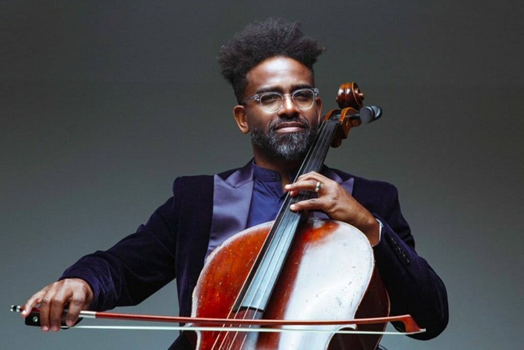 Okorie "OkCello" Johnson poses with his cello.