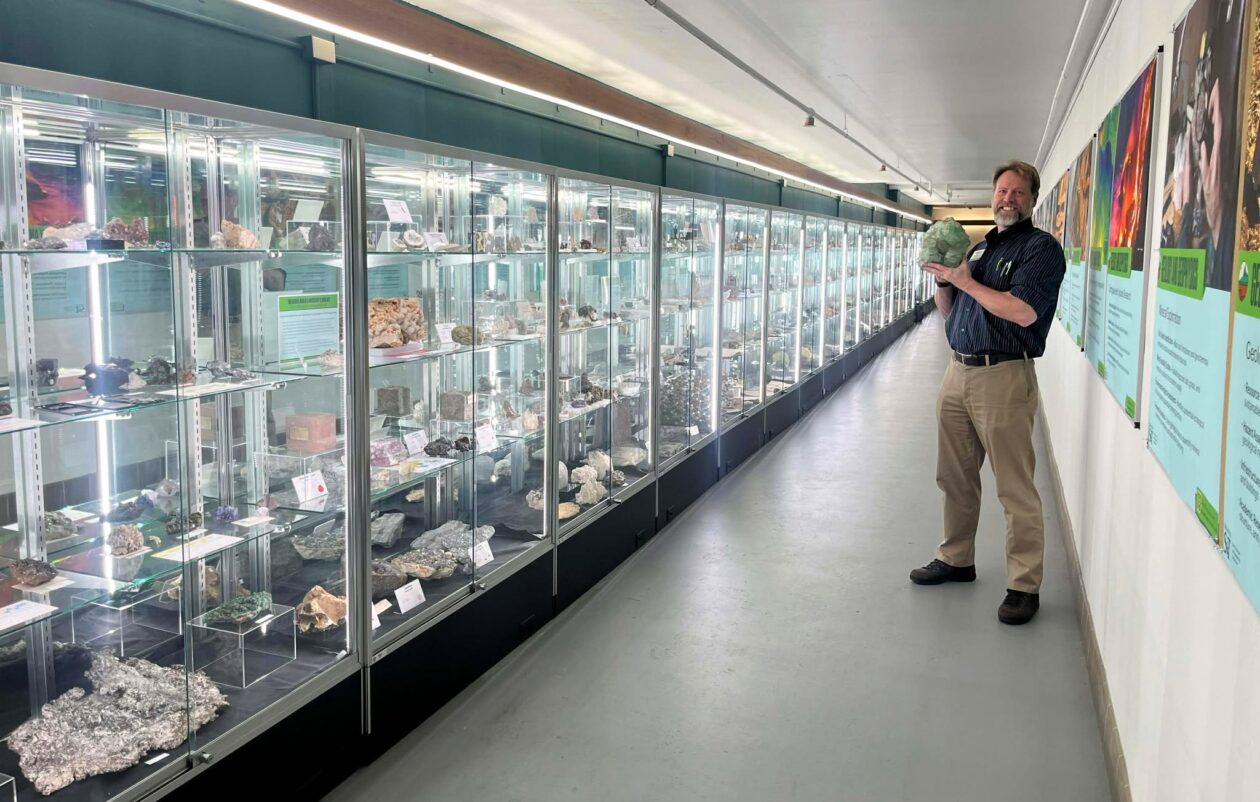 Peter Bachle, the museum’s curator, displays a large green fluorite crystal. He says fluorite is a primary ingredient in most toothpastes. Photo by Greg Edwards/Missouri S&T.