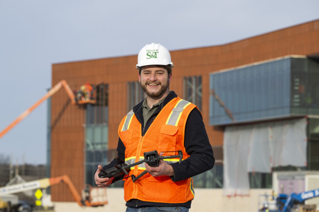 Bradley Clay holding a drone