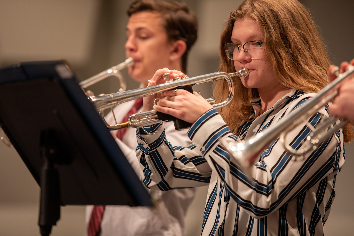 Students play trumpet during a jazz band concert at Leach Theatre.