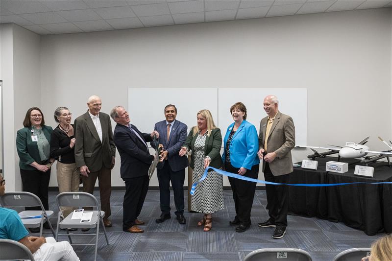 Group photo of ribbon cutting