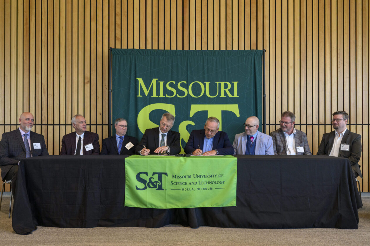 Drs. Kamal Khayat, center left, S&T vice chancellor for research and innovation, and Todd Combs, INL deputy laboratory director for science and technology and chief research officer, sign the agreement. Joining them for the signing are, from left: Drs. David Borrok, vice provost and dean of the S&T College of Engineering and Computing; John Harris, S&T provost and executive vice chancellor; Joseph Newkirk, S&T chair and professor of nuclear engineering and radiation science; Simon Pimblott, INL chief scientific officer for nuclear science and technology; Matthew Watrous, INL chief science officer for national and homeland security; and Paul Talbot, INL senior manager of integrated systems and thermal analysis for energy and environmental science and technology. Photo by Michael Pierce/Missouri S&T