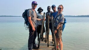 From left, Missouri S&T Ph.D. students Trenton McEnaney, Oluwakunle Moyofoluwa Ogunsakin, Linus Victor Anyanna and Suvrajit Ghosh, along with Dr. Marta Marchegiano from the University of Granada, Spain, hold sediment cores they collected during a field expedition in Guatemala. Photo courtesy of Ghosh.