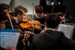 Students performing onstage at Leach Theatre.