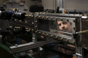 Dr. Davide Viganò examines Missouri S&T’s supersonic wind tunnel. Photo by Blaine Falkena/Missouri S&T.