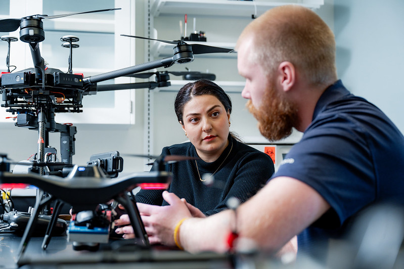 Effat Eskandari and USDA scientist observing drones at the Beltsville Agricultural Research Center in Beltsville.