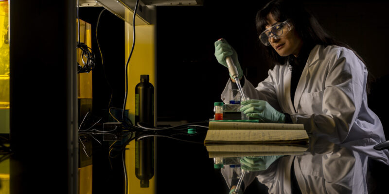 Cover photo of researcher in lab